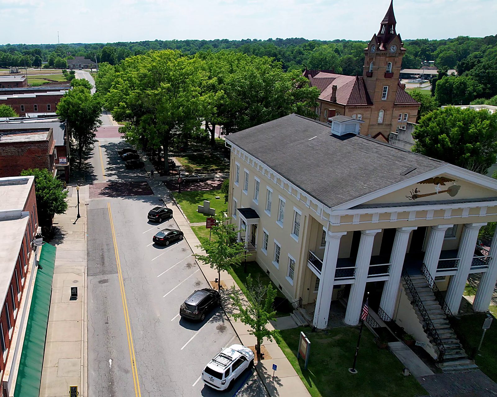 An aerial view of downtown Newberry, South Carolina — the historic courthouse and the Opera House clock tower
